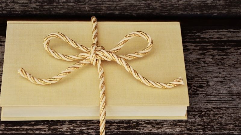 Stories for the Holiday Season | bookgift on the wooden table | Lift Legal